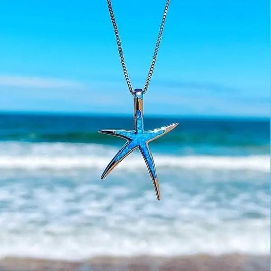 Gouden ketting van blauw opaal en zilveren ster