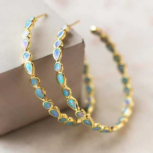 Vintage gouden oorbellen met blauwe opaal